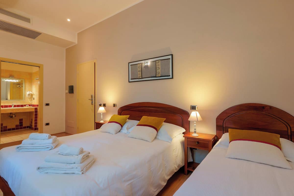 Triple Room | Minibar, in-room safe, desk, soundproofing