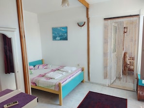 Family Quadruple Room, 2 Bedrooms | In-room safe, desk, free WiFi