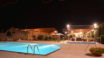 Outdoor pool, open 10:00 AM to 6:00 PM, pool umbrellas, pool loungers