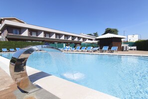 Seasonal outdoor pool, open 10:00 AM to 7:00 PM, pool loungers