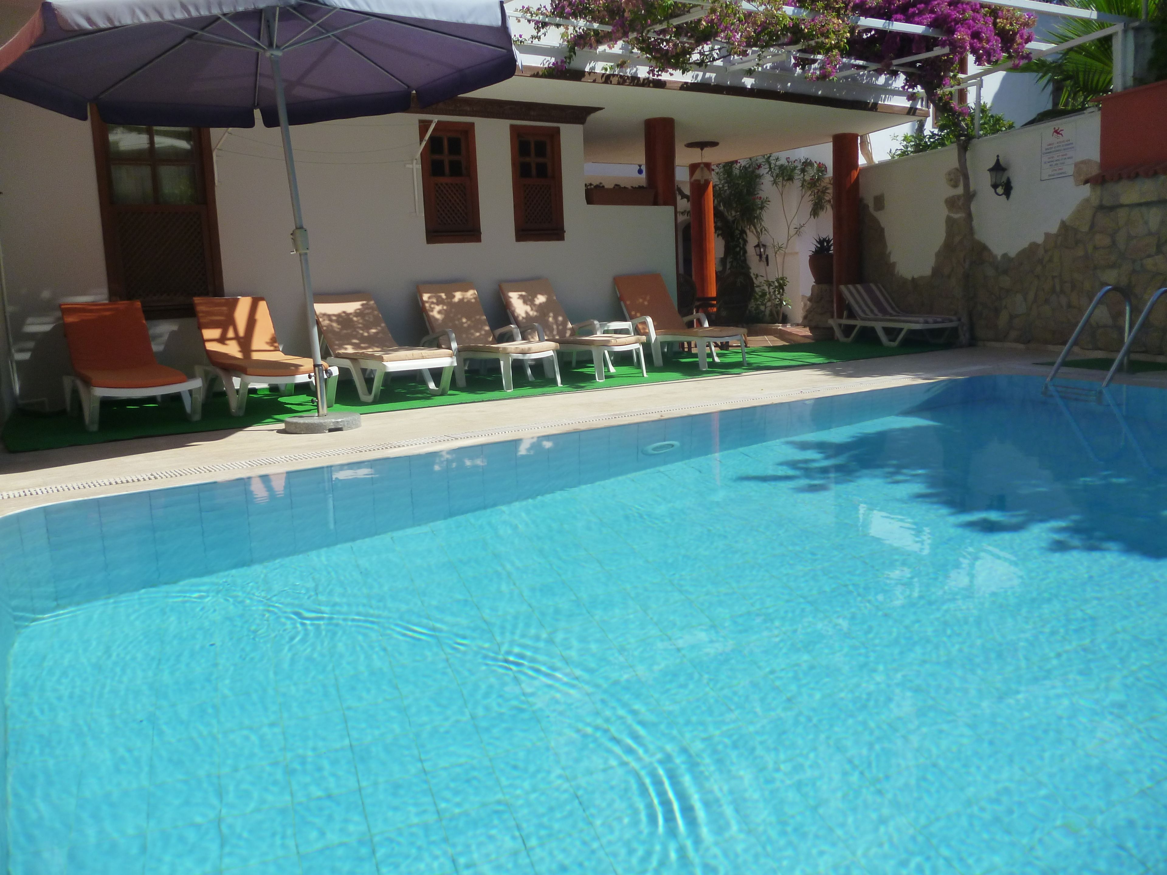 seasonal outdoor pool, pool umbrellas, pool loungers
