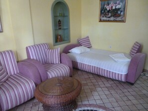 Standard Condo | Living area | Flat-screen TV, books - Hotel Frankfurt (Antalya)