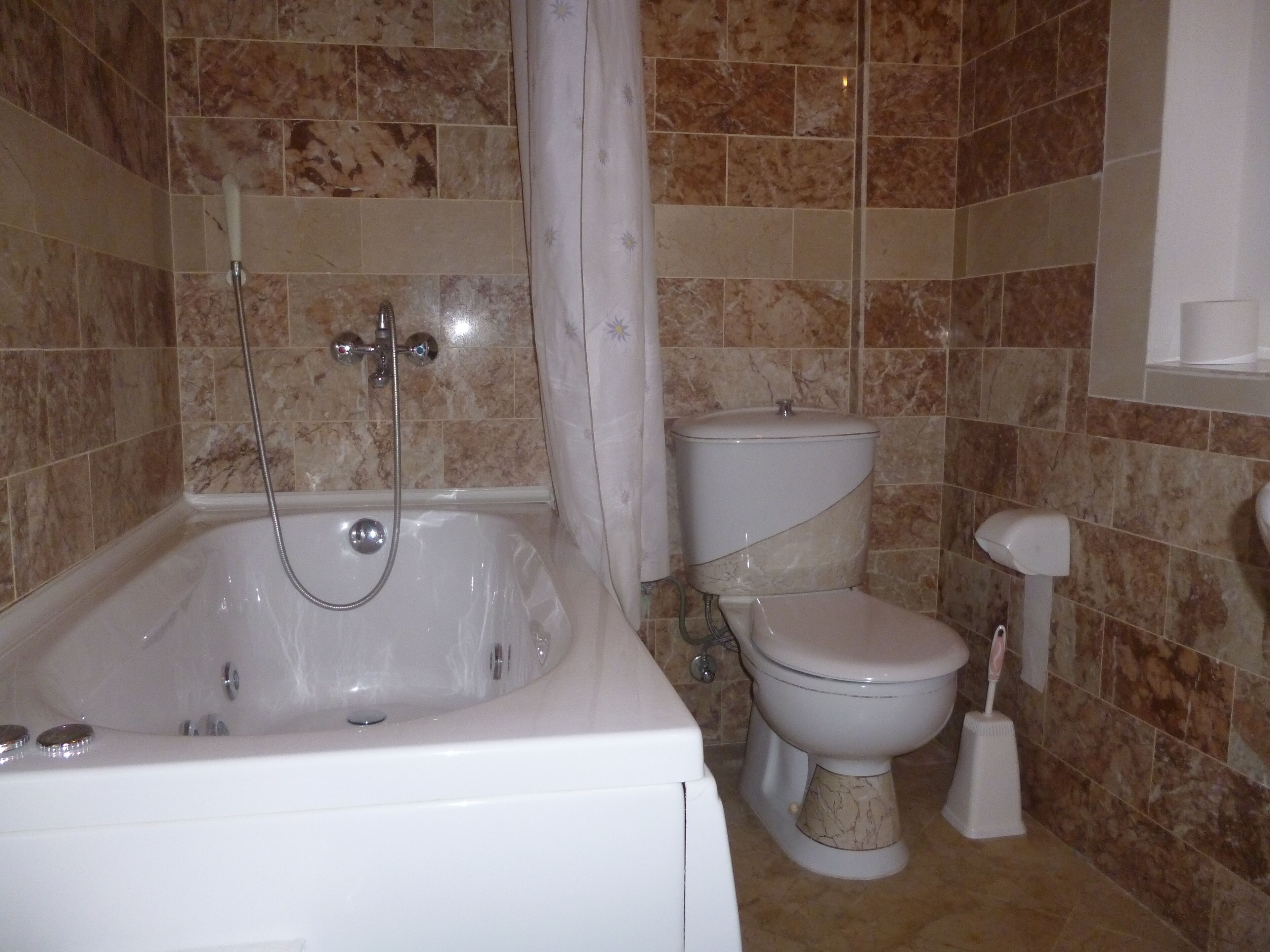 standard condo | bathroom | hair dryer, slippers, towels, toilet paper