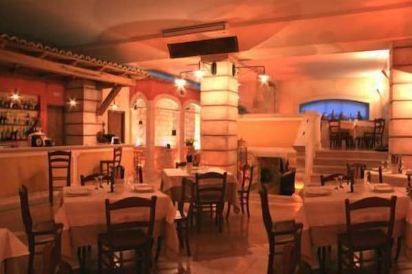 Breakfast, lunch, dinner served; local cuisine, al fresco dining