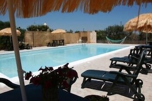 Seasonal outdoor pool, open 9:30 AM to 7:30 PM, pool umbrellas