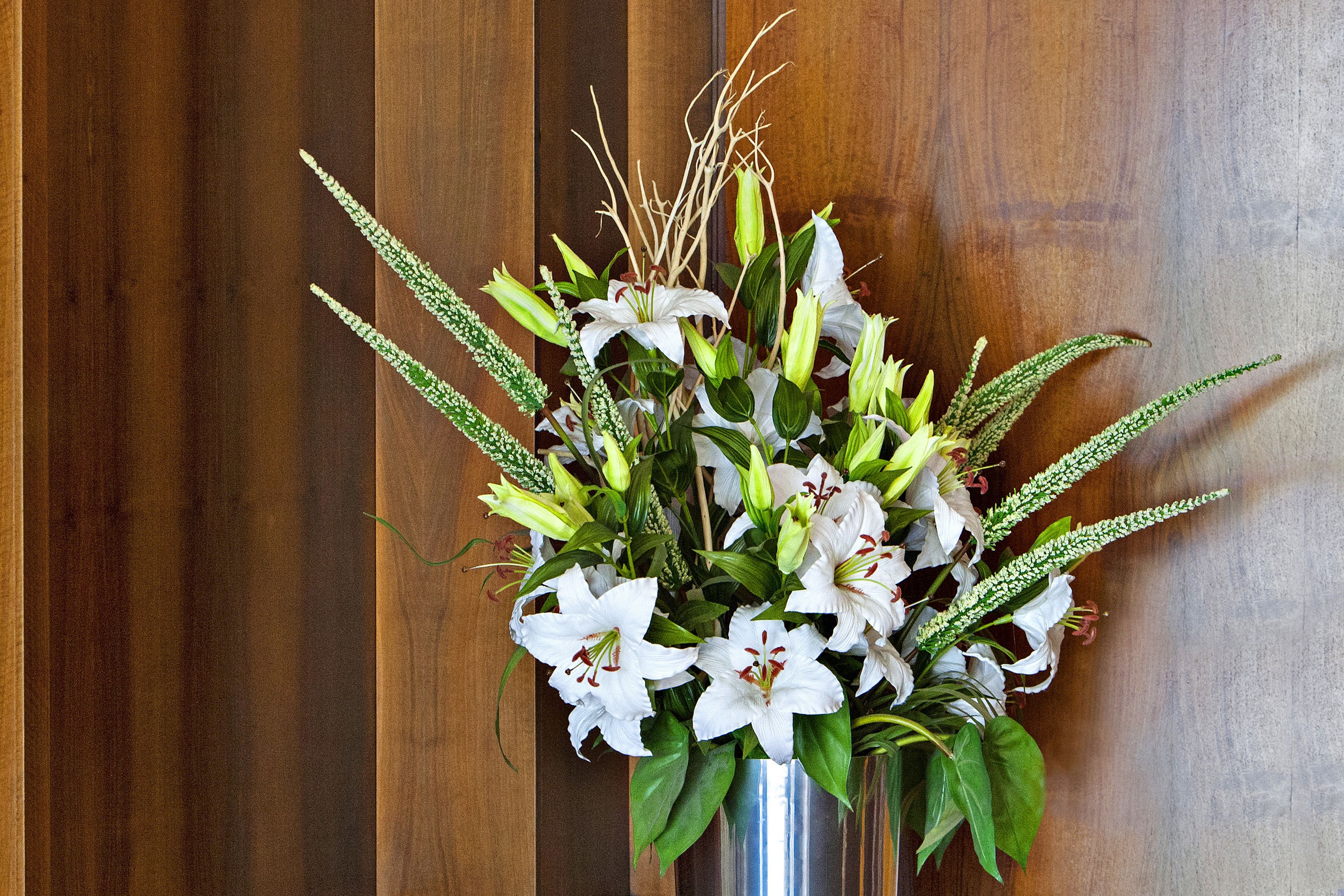 A bouquet of white flowers in a vase.