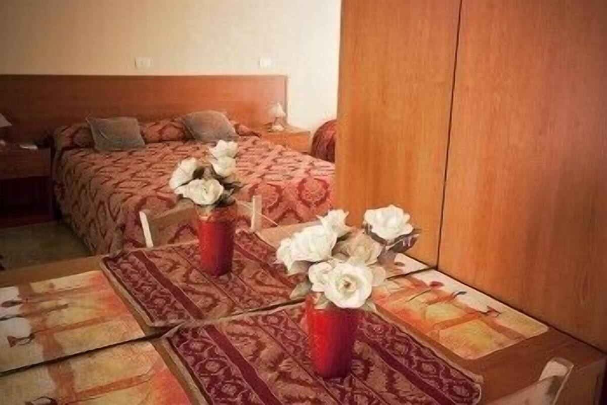 Chambre triple | Minibar, coffre-fort, système d’insonorisation, lit de bébé