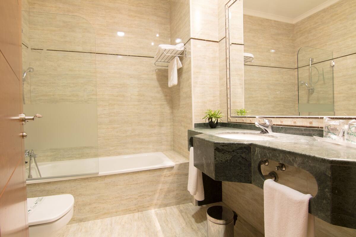 free toiletries, hair dryer, bidet, towels