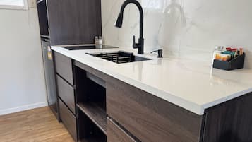 Fridge, microwave, stovetop, cookware/dishes/utensils