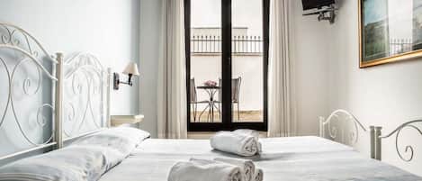 Habitación doble | Camas Select Comfort, cunas gratuitas, camas extra y wifi