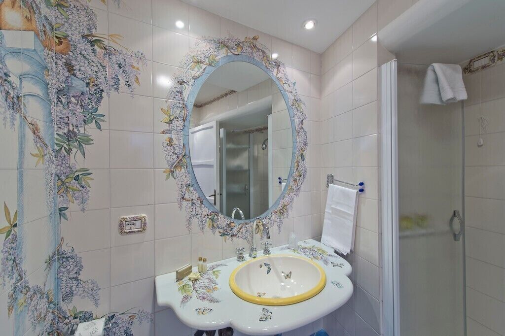 Superior Room, Sea View | Bathroom | Shower, hair dryer, slippers, towels