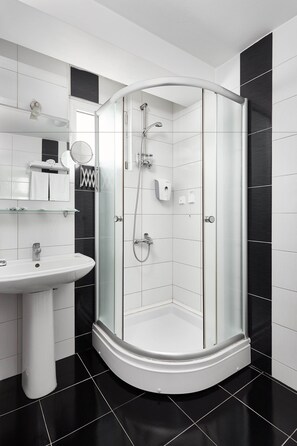Shower, free toiletries, hair dryer, slippers