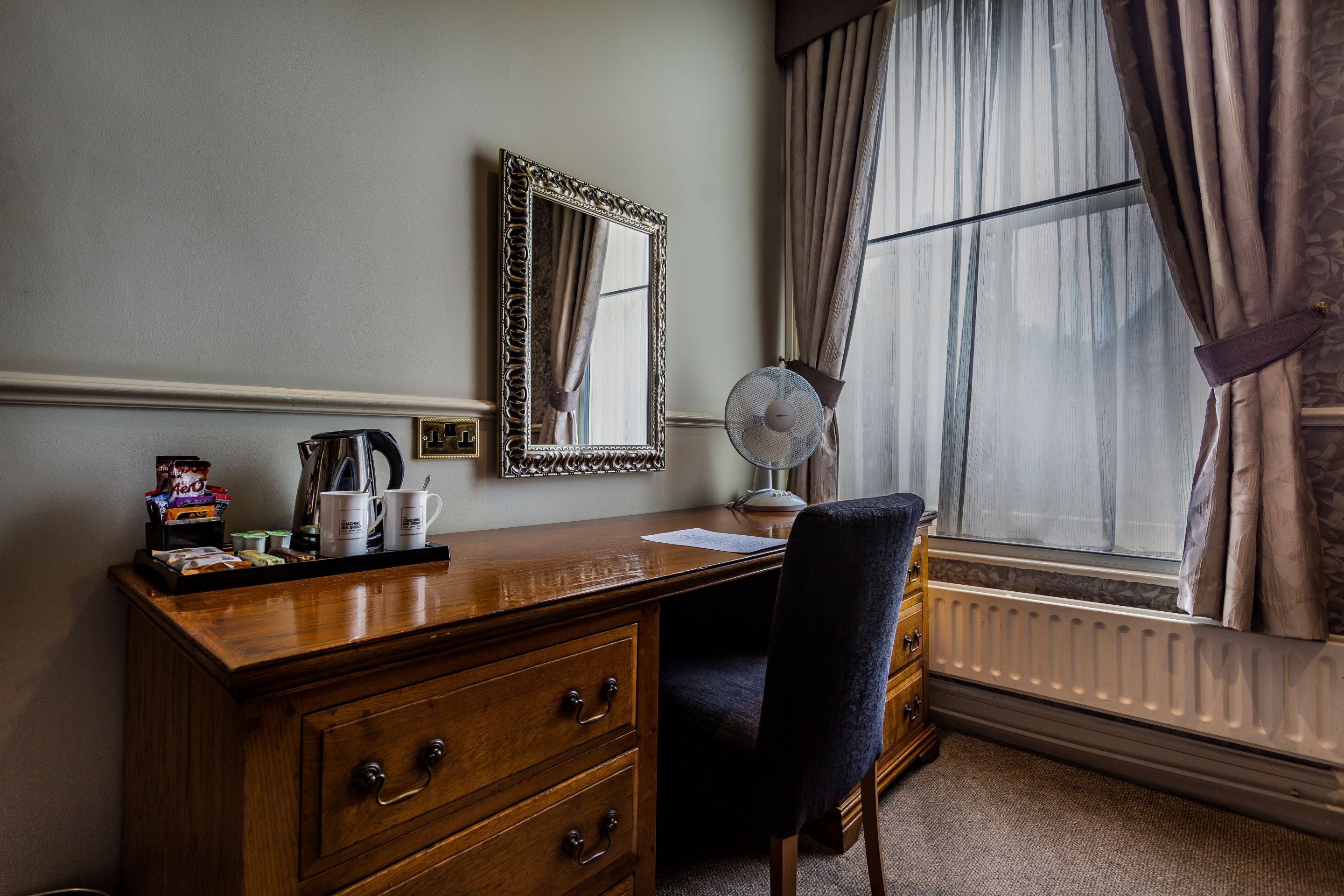 deluxe suite | living area | tv