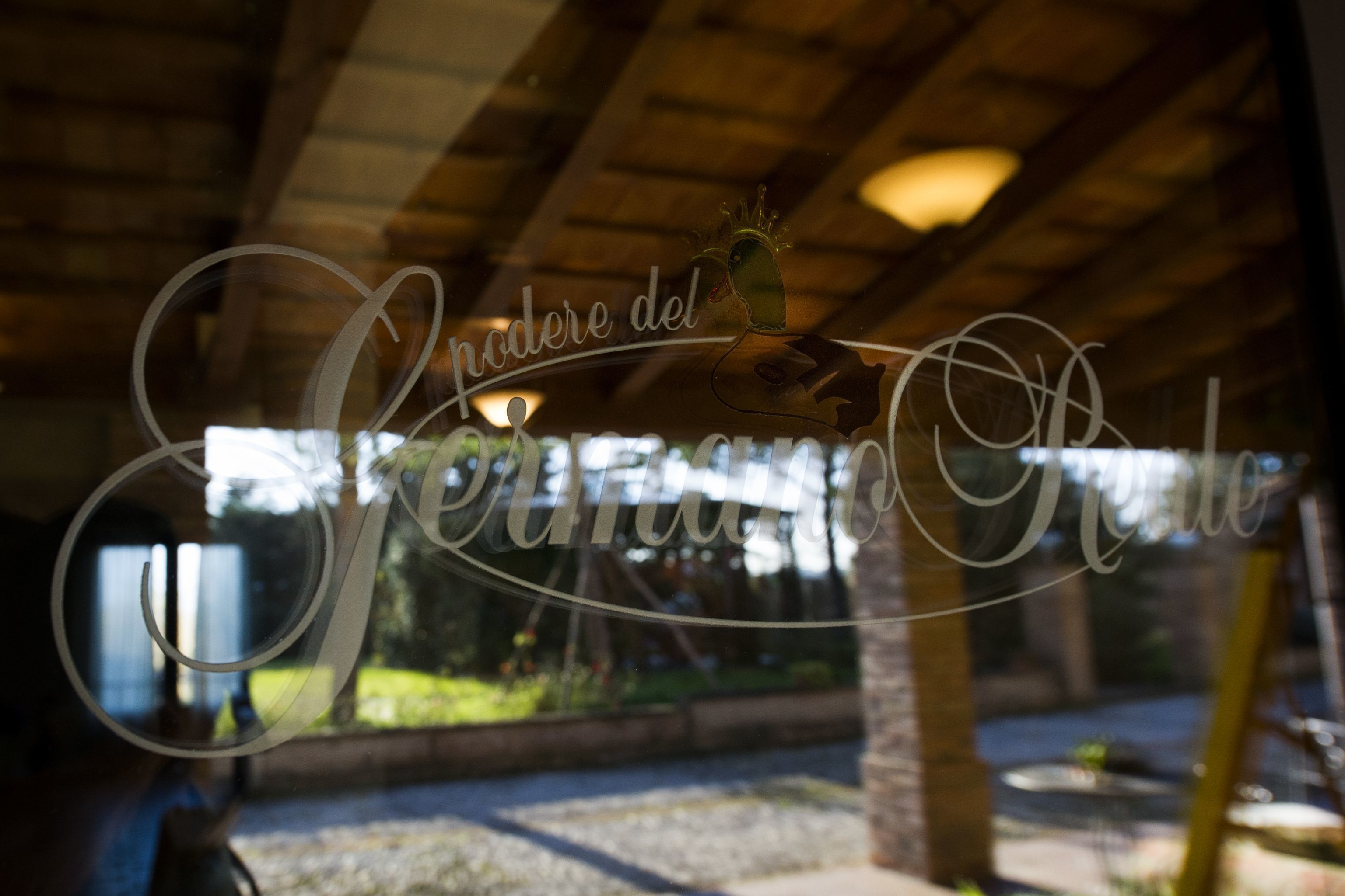 A sign with the text "Andare del Seranno Ristorante" in a cursive font, indicating the name of a restaurant.