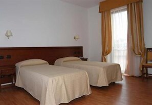 Quadruple Room | Minibar, in-room safe, desk, free WiFi