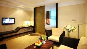 Business King Suite | Living area | 26-inch LCD TV with cable channels, TV - Free Comfort Holiday Hotel (Beijing)