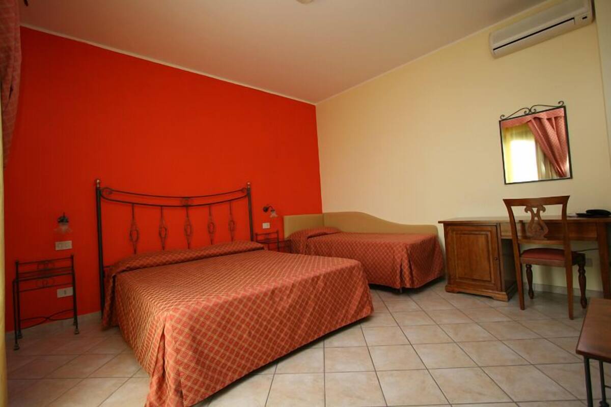 Triple Room | Minibar, in-room safe, desk, blackout drapes