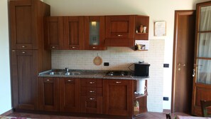 Comfort Apartment, 1 Bedroom, Garden View, Ground Floor (Mimosa) | Private kitchen | Fridge, stovetop, cookware/dishes/utensils - Il Chiassetto (Cascina)