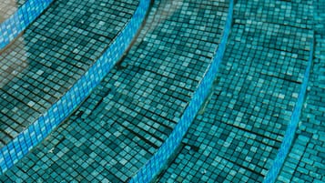 A close-up of a tiled floor with a wavy pattern.