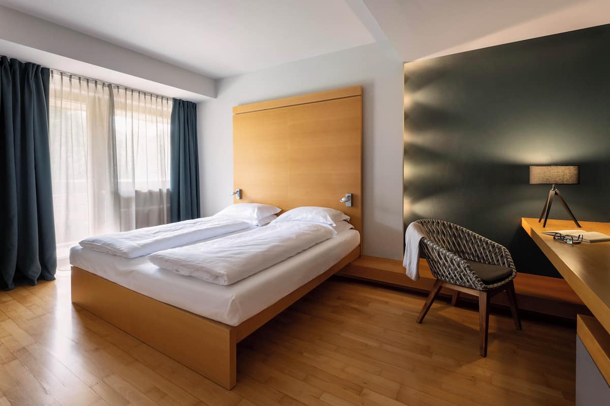 Hypo-allergenic bedding available, down comforters, minibar