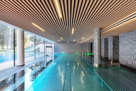 Indoor pool, outdoor pool, pool umbrellas, sun loungers
