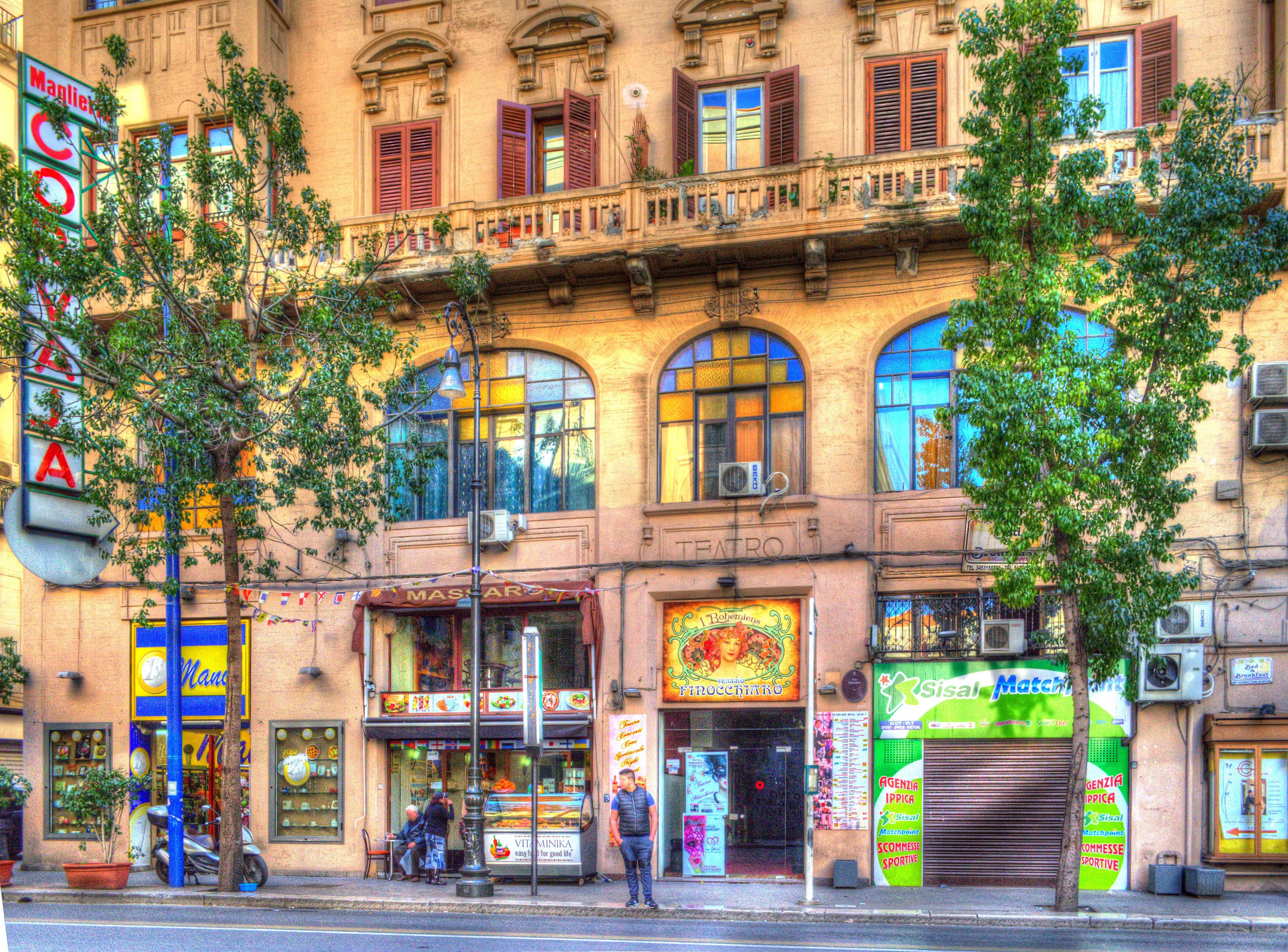 A historic building with a ground-floor restaurant and upper-floor shops.