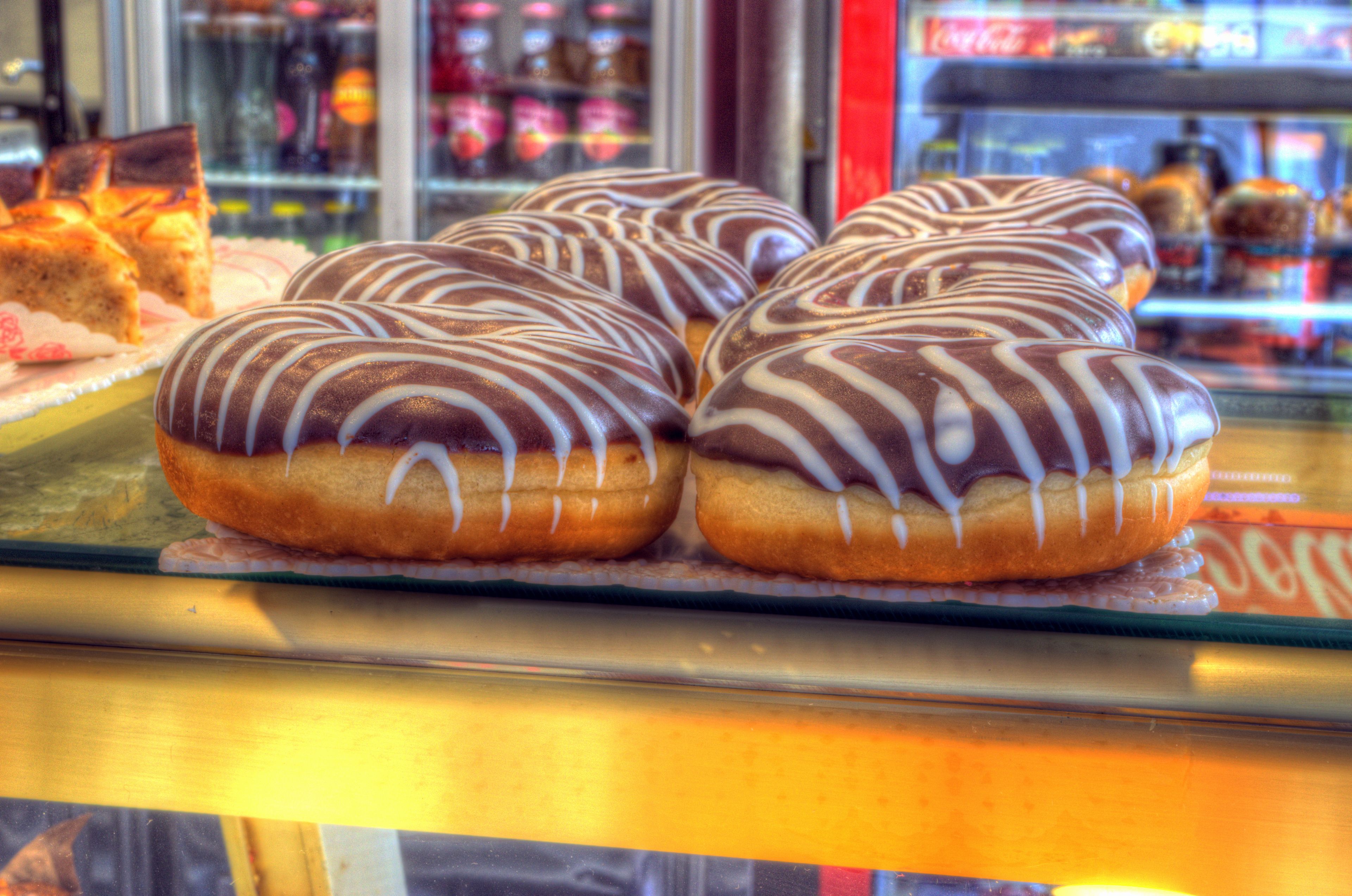 A display case with glazed donuts.
