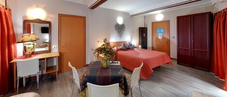 Comfort Quadruple Room | Premium bedding, down duvets, memory-foam beds, laptop workspace