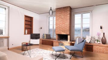 Appartamento Deluxe | Area soggiorno | TV a schermo piatto