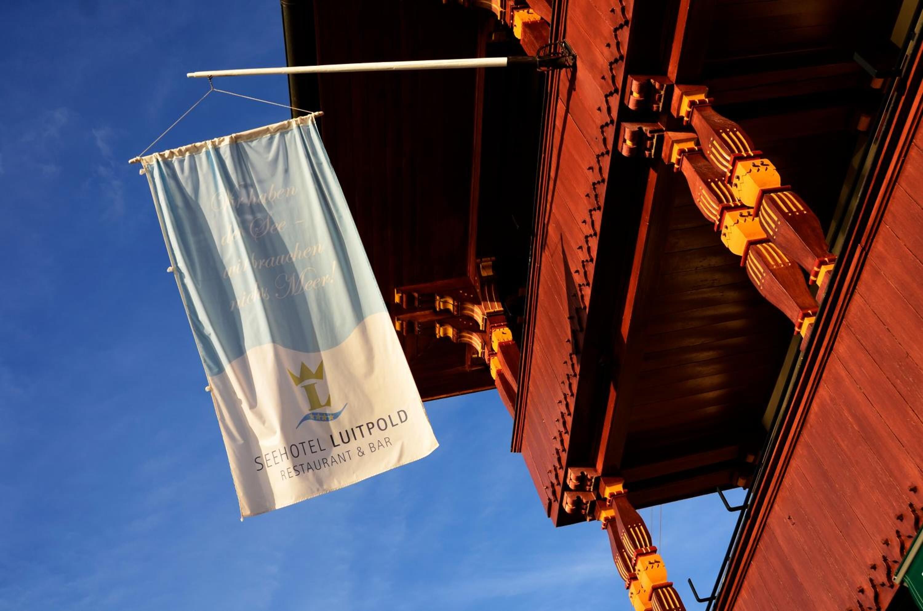 A banner for Seehotel Luitpold Restaurant & Bar against a clear blue sky.