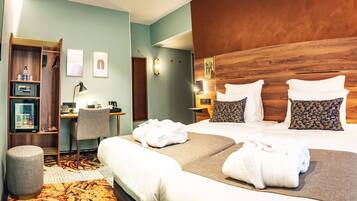 Luxe beddengoed, een minibar, een kluis op de kamer, een bureau