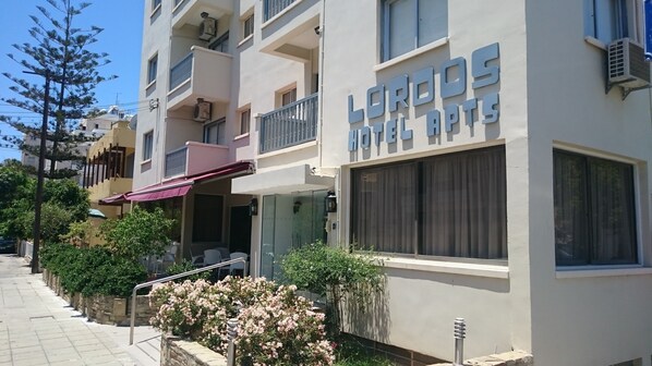A hotel named 'LORDOS HOTEL GROUP' with a modern facade, balconies, and a visible entrance. - Lordos Hotel Apartments (Limassol)