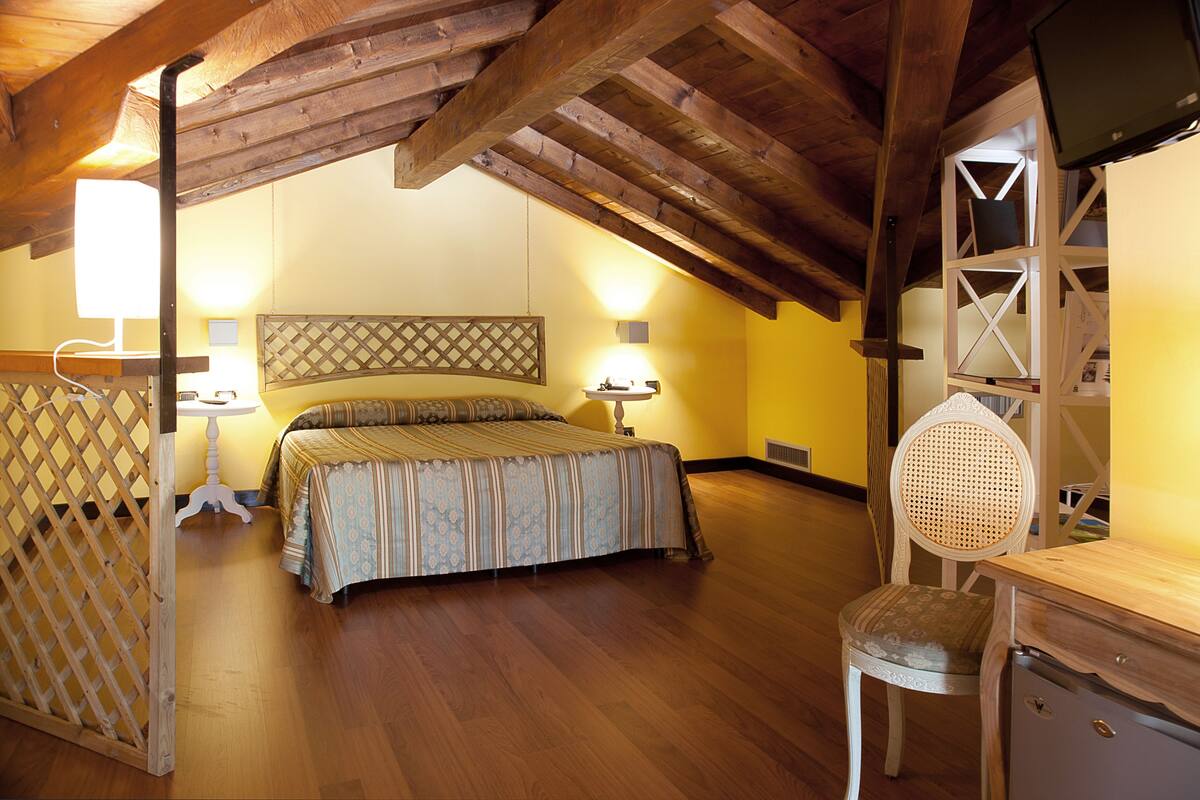 family room, private bathroom | minibar, in-room safe, individually decorated, desk