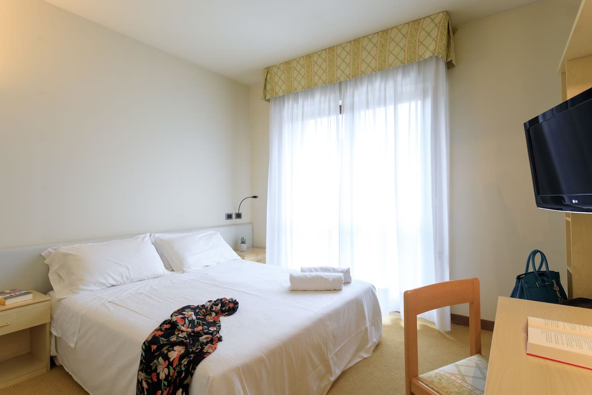 Family Suite, 2 Bedrooms | In-room safe, desk, blackout curtains, iron/ironing board
