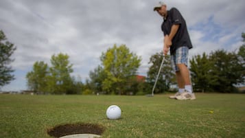 Golfers can enjoy a challenging game on this well-manicured course.