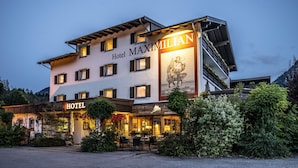 A multi-story hotel with a prominent sign reading "Hotel Maximilian." - Hotel Maximilian (Ehenbichl)