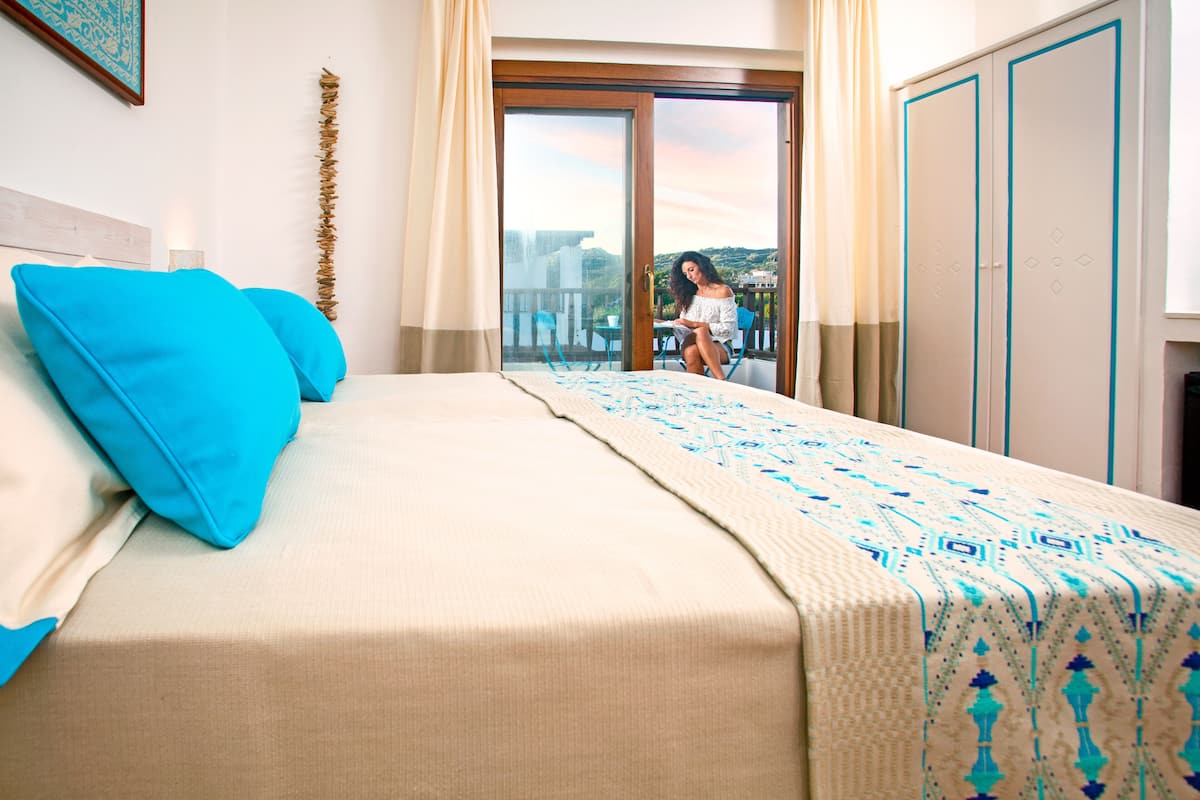 Junior Suite,  Balcony, Pool View | Minibar, in-room safe, blackout curtains, WiFi