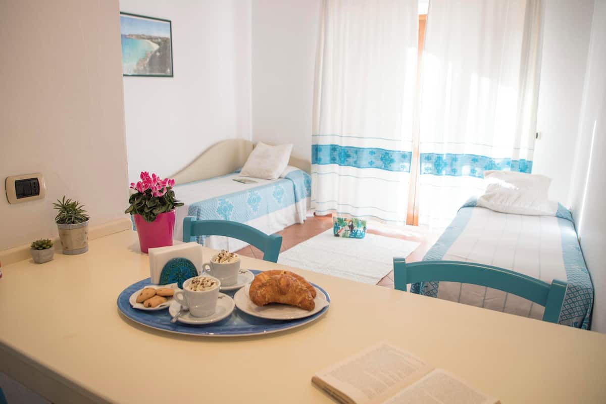 Quadruple Room, Balcony | Minibar, in-room safe, blackout drapes, WiFi