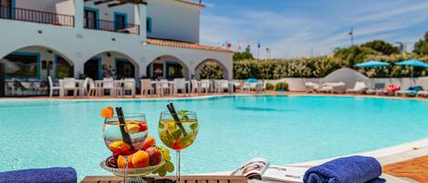 Outdoor pool, open 10:00 AM to 7:00 PM, pool umbrellas, sun loungers