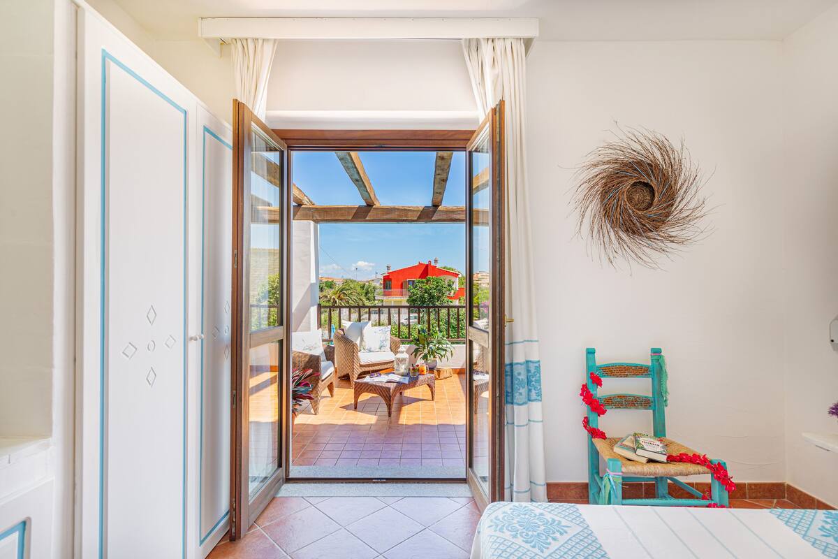 Deluxe Room, Terrace, Pool View | Minibar, in-room safe, blackout curtains, WiFi