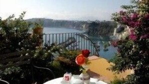 A table set for tea with a view of a lake and a bridge. - La Casa sul Mare (Procida)