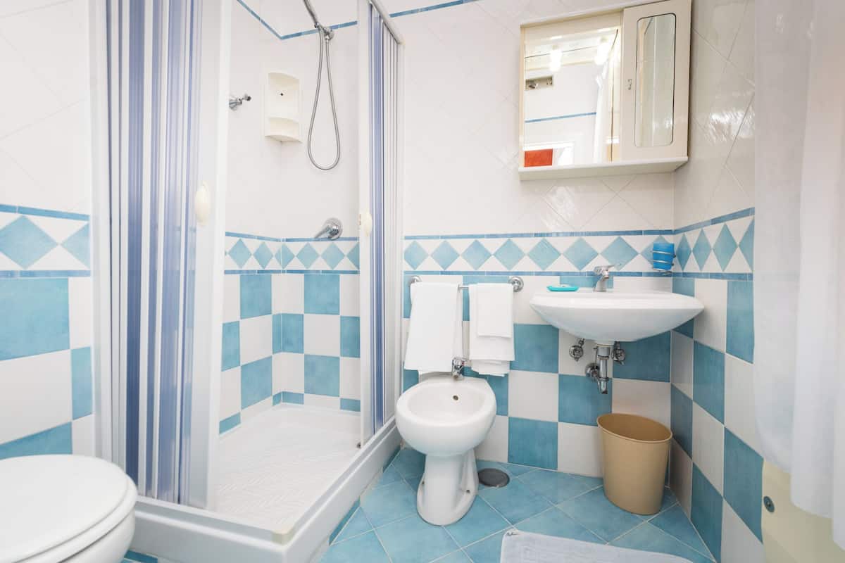 double room | bathroom | shower, hair dryer, towels, soap