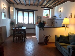 Family Suite, Garden View | Living area | 25-inch LED TV with satellite channels, TV, first-run movies