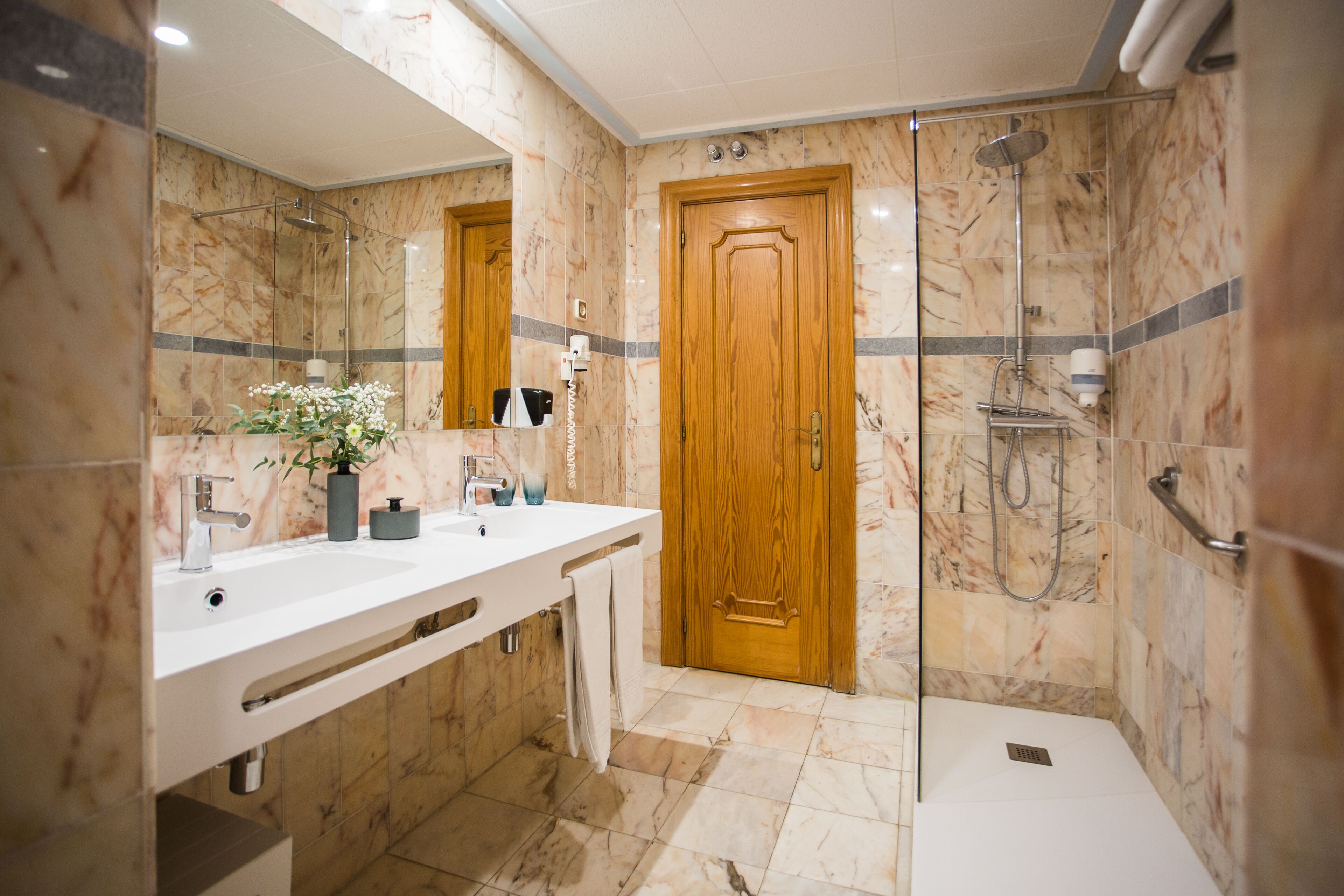 basic twin room | bathroom | hair dryer, towels, soap, shampoo