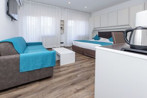 Colchones con pillow-top, minibar y caja de seguridad en la habitación 