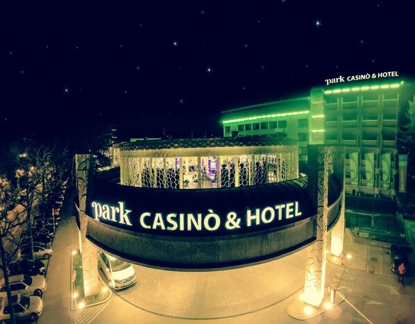 A night view of the Park Casino & Hotel with a prominent illuminated sign and a modern building structure. - Park, Hotel & Entertainment (Nova Gorica)