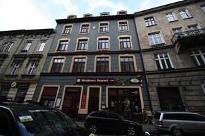 A multi-story building with a restaurant named "Résidence Tournet" on the ground floor. - Résidence Tournet (Kraków)