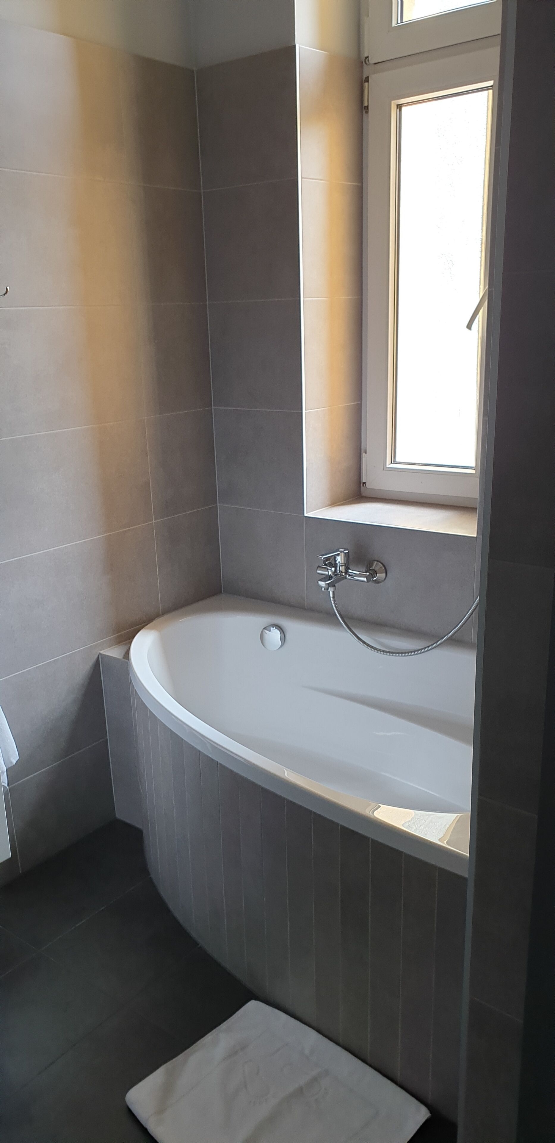 superior double room | bathroom | shower, hair dryer, towels