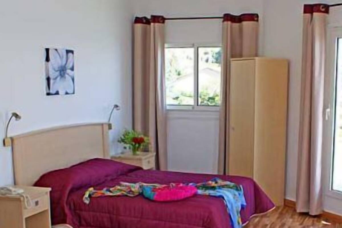 Desk, blackout curtains, iron/ironing board, rollaway beds