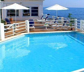 Seasonal outdoor pool, open 9 AM to 8 PM, sun loungers